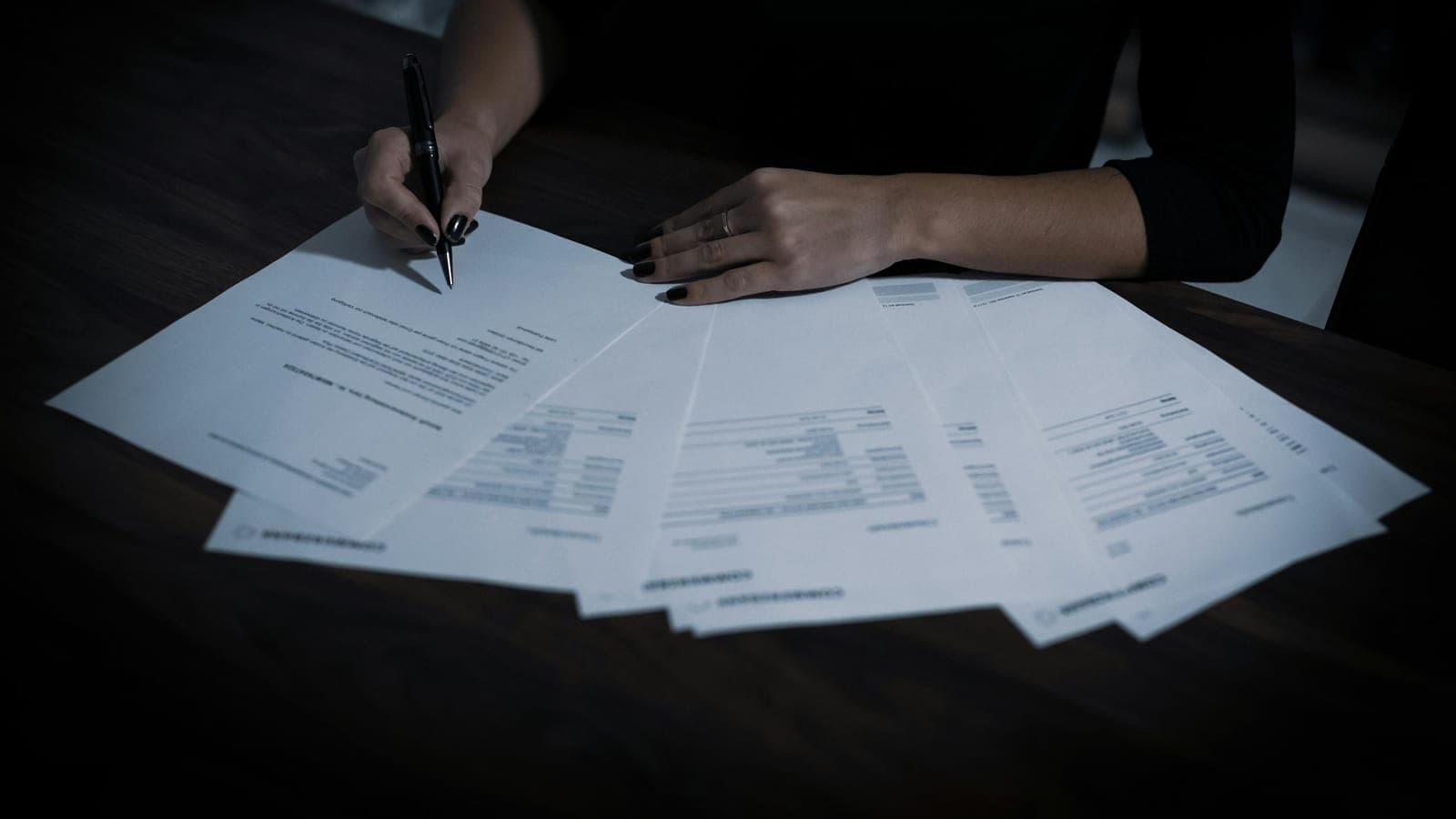 Claims professional working through a table of paperwork