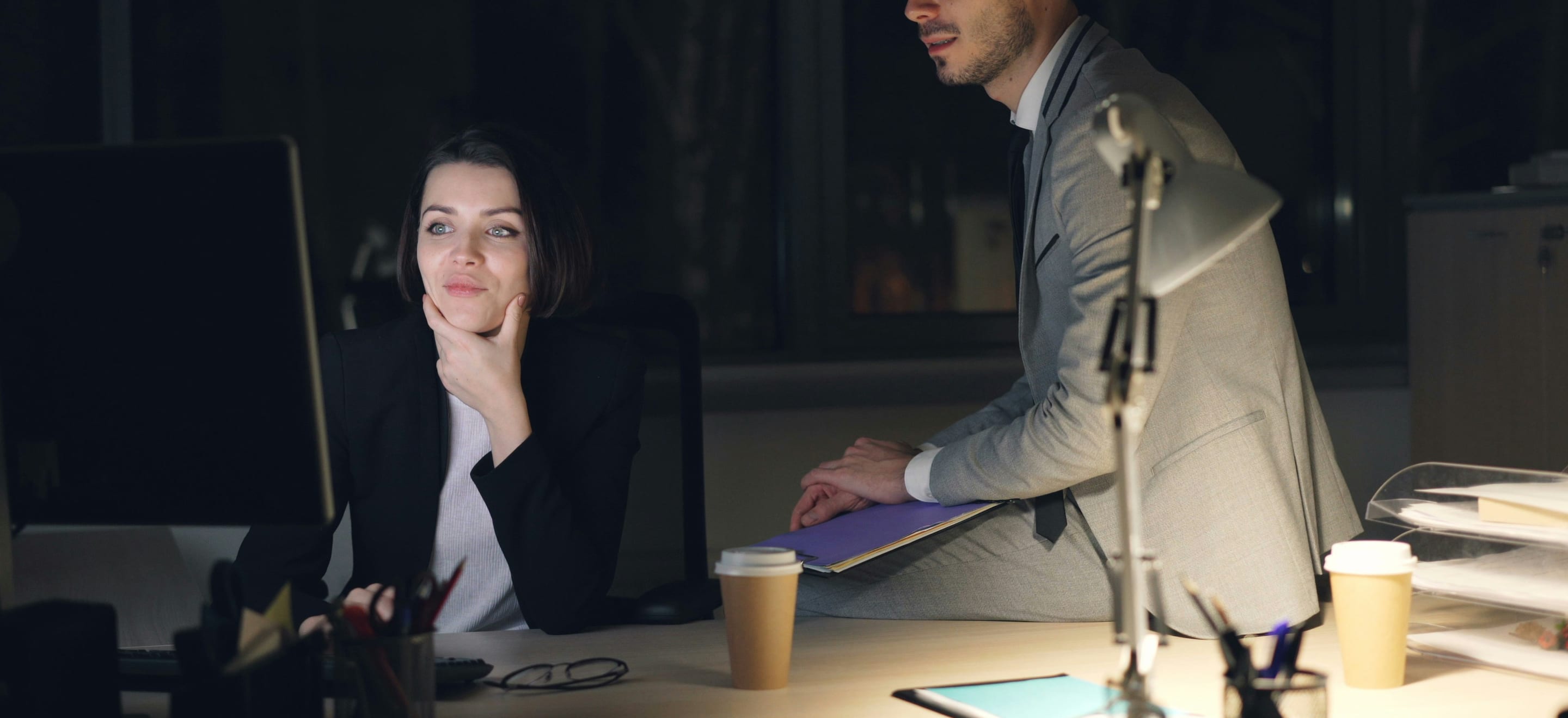 Two colleagues working late at the office