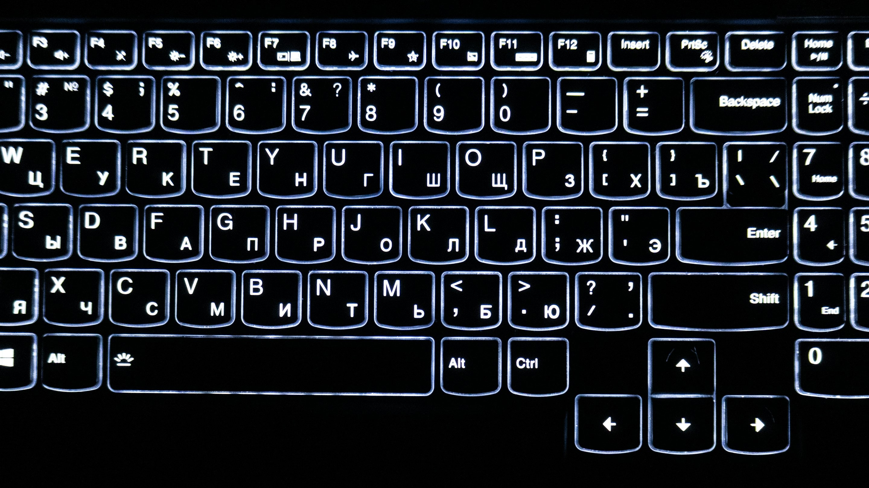 A backlit keyboard with English and Cyrillic letters on the keys